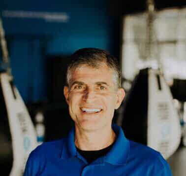 Roger Martin smiling in a RockBox polo